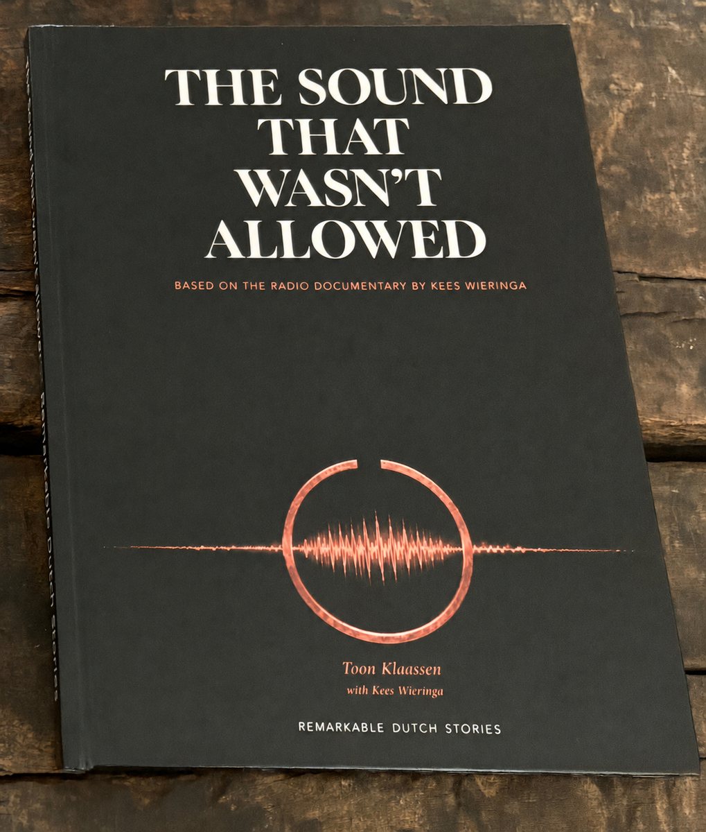The hardcover book The Sound That Wasn’t Allowed on a wooden table